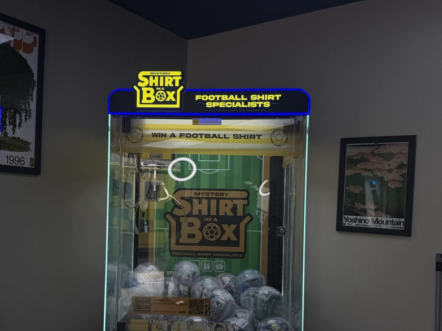 A Shirt in a Box claw machine at home