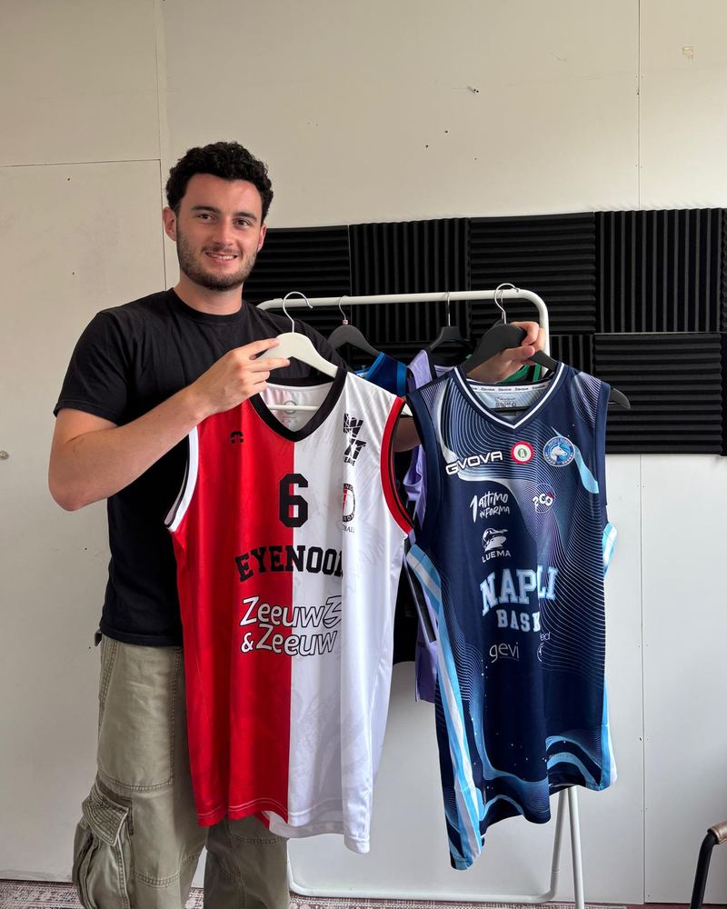 Rory holding two basketball shirts