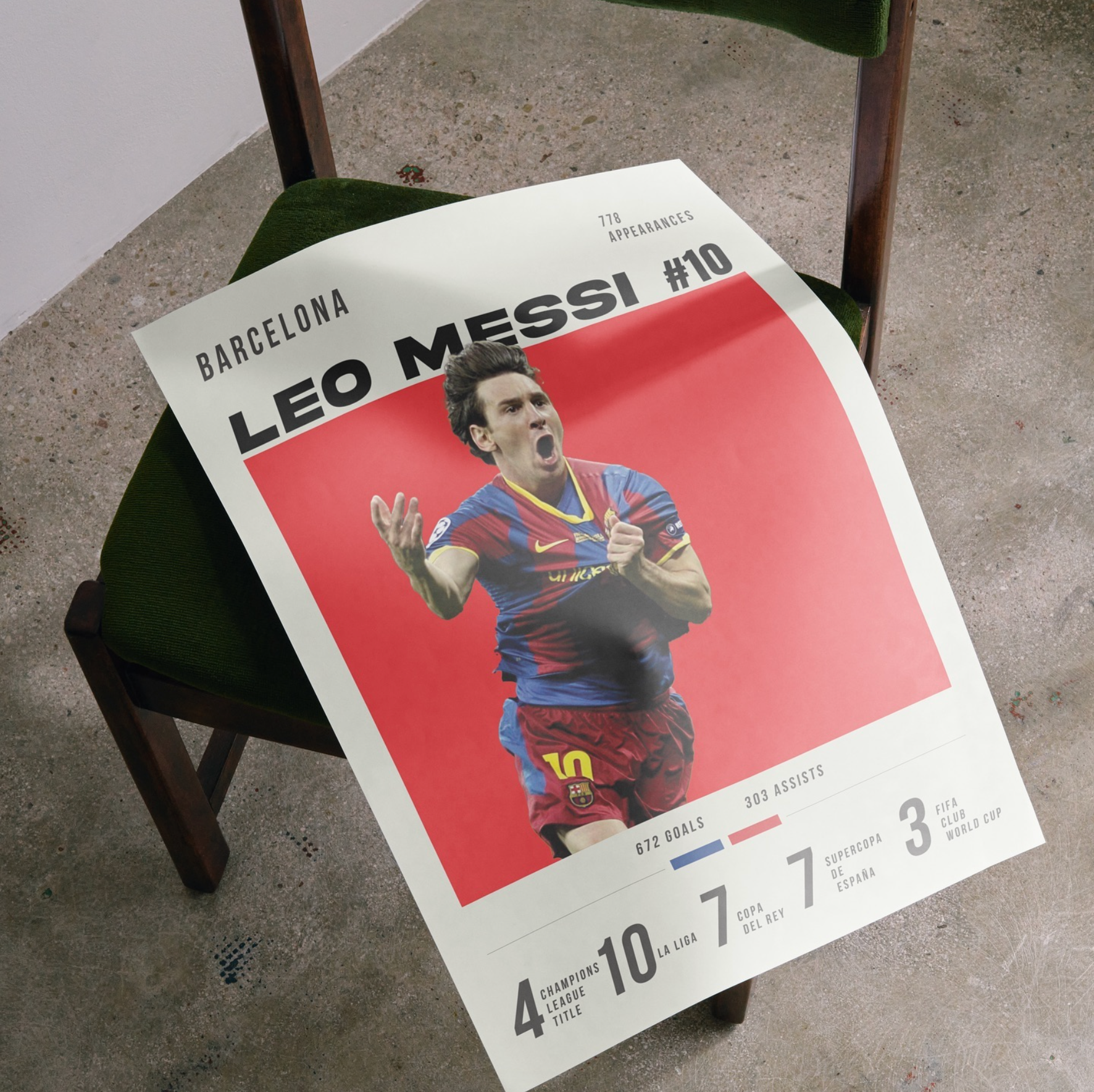 Unframed football kit art print resting on green velvet chair