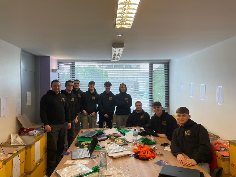 The team squeezed into a small office